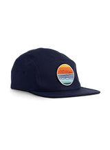 Dawn Patrol 5 Panel Cap in navy - a designer baseball cap by Sutsu with sun, sea and birds circular woven badge.