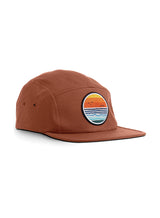 Dawn Patrol 5 Panel Cap in terracotta - a designer baseball cap by Sutsu with sun, sea and birds circular woven badge.