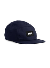 OG Badge 5 Panel Navy Cap - a sustainable cap by Sutsu with an abstract logo.