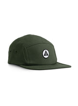 Sutsu Mountain Circle 5 Panel Cap - green cap on white background - designer headwear with circle, triangle and tree badge.