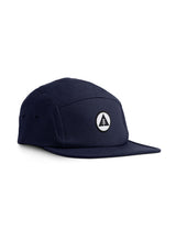 Sutsu Mountain Circle 5 Panel Cap - navy cap on white background - ethical headwear with circle, triangle and tree badge.