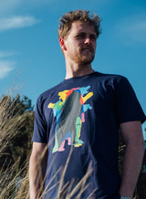 Man wearing a Sutsu Dancing Bear T-Shirt - a navy, organic cotton t-shirt with kaleidoscopic bear graphic design.