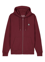 Sutsu Wylder Woven Badge Zip Hoodie - a burgundy organic cotton hoodie with embroidered sun and trees triangular badge logo.