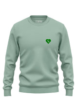 Tree Love EMB Sweatshirt - an organic cotton sweatshirt in pale green with an embroidered tree and heart graphic from Sutsu - flat lay.