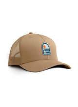 Sand beige Sutsu Sun & Waves Trucker Cap - a sustainable cap featuring an abstract sun and waves graphic badge.
