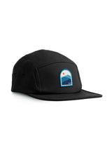 Sutsu Blue Mountain 5 Panel Cap - black cap on white background - sustainable headwear with sun and mountain range graphic.