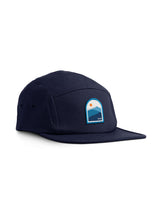 Sutsu Blue Mountain 5 Panel Cap - navy cap on white background - designer headwear with sun and mountain range badge.