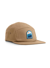Sutsu Blue Mountain 5 Panel Cap - beige cap on white background - designer headwear with sun and mountain range badge.