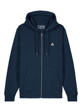 Sutsu Wylder Woven Badge Zip Hoodie - a navy organic cotton hoodie with embroidered sun and trees triangular badge logo.